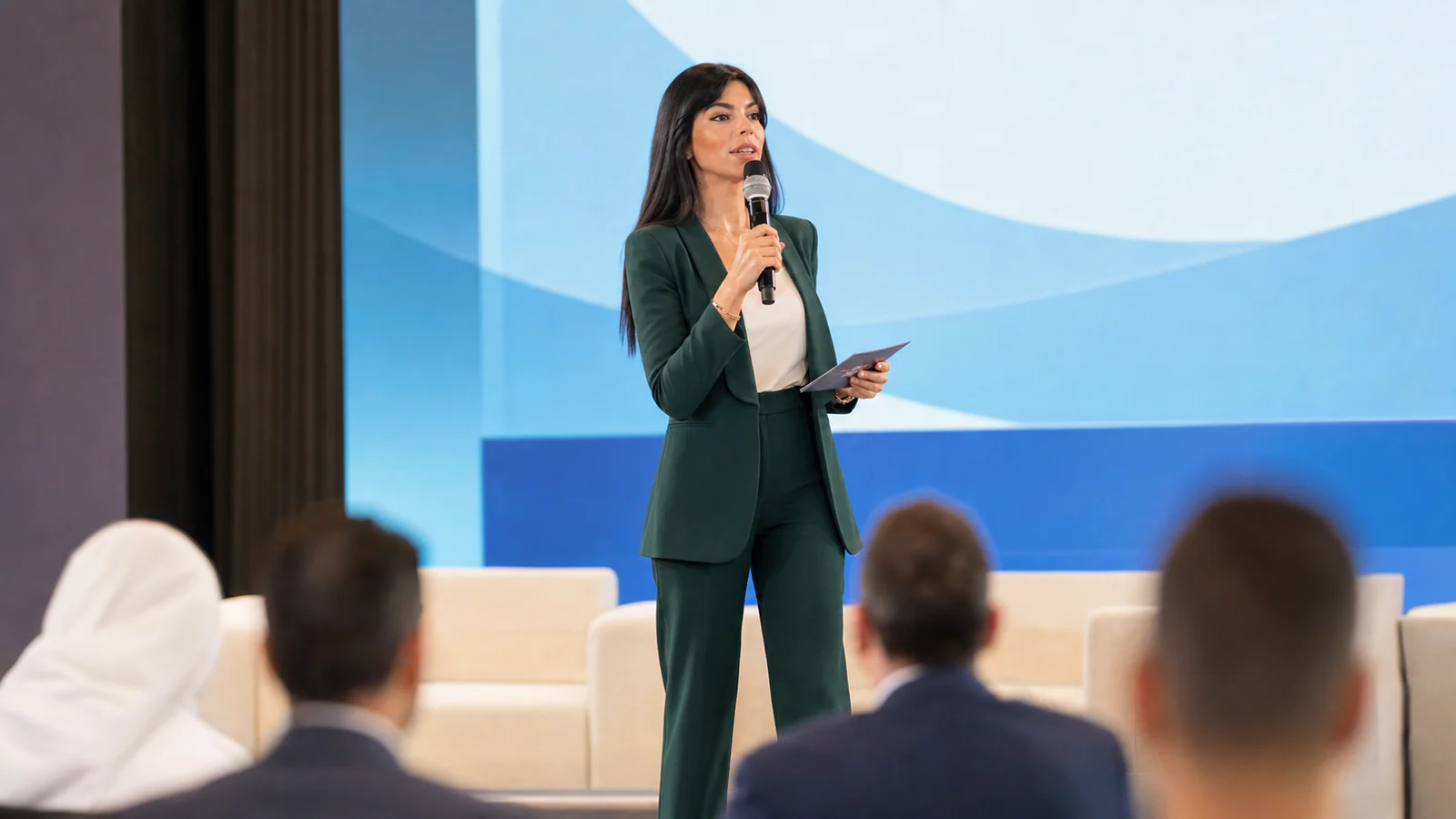 Rima Iskandarani hosting a bilingual corporate conference in Dubai